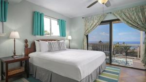 En eller flere senge i et værelse på Walua Hale, By The Trail