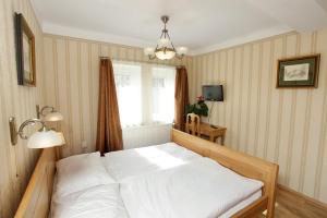 Posteľ alebo postele v izbe v ubytovaní Hotel Štekl - Hrubá Skála