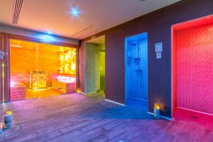 a bathroom with a walk in shower and a walk in shower at Nura Santa Ponsa & Spa in Santa Ponsa