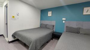 Postel nebo postele na pokoji v ubytování APD HOTEL + 21 fotografií