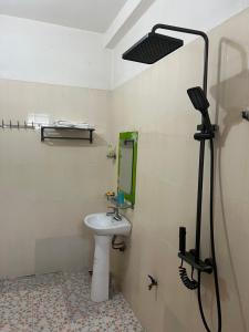 a bathroom with a sink and a mirror at Minh An in Dien Bien Phu