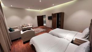 Postel nebo postele na pokoji v ubytování شقق نسمات العلا Nasmat AlUla Apartments