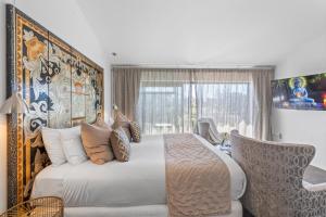 Postel nebo postele na pokoji v ubytování Orewa Beachcomber + 37 fotografií