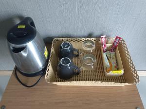 a basket on top of a table with a blender at Apsara Inn in Pattaya South