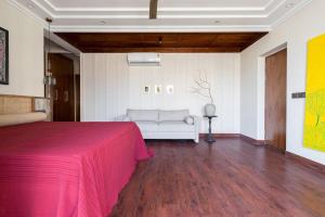 a bedroom with a bed and a couch in a room at 4bhk-Villa at dlf valley township Panchkula in Panchkula +41 photos