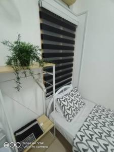 Ένα ή περισσότερα κρεβάτια σε δωμάτιο στο MyHomestay Botani