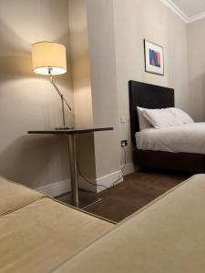 Postel nebo postele na pokoji v ubytování Green Ariana Hotel - near Wembley and central London