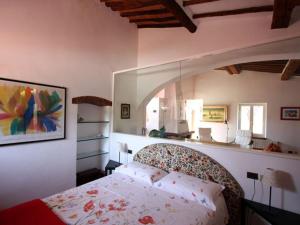 a bedroom with a bed and a large window at Villa San Giuseppe in Porto Azzurro