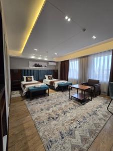Кровать или кровати в номере Ziyorat Luxury Hotel