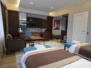 Кровать или кровати в номере Ziyorat Luxury Hotel
