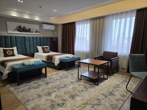 Кровать или кровати в номере Ziyorat Luxury Hotel