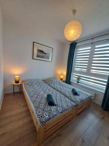 Katil atau katil-katil dalam bilik di Apartament Bazylek, miejsce parkingowe w garażu podziemnym