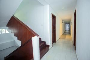 a hallway with stairs and a stair case at Lucky Seven Hikkaduwa in Hikkaduwa