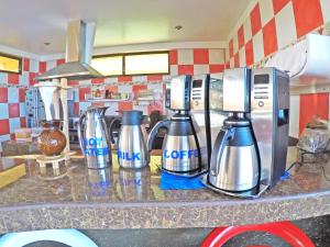 a kitchen counter with two bottles of water on it at Galápagos Eco Friendly in Puerto Baquerizo Moreno