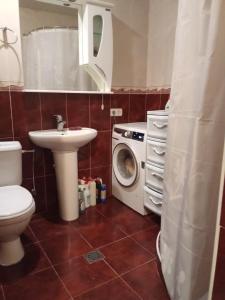 a bathroom with a washing machine and a sink at Sirik in Yerevan