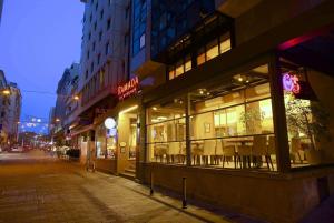 a store front of a street at night at Ramada By Wyndham İstanbul Taksim in Istanbul