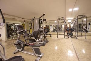 a gym with several exercise equipment in a room at Ramada By Wyndham İstanbul Taksim in Istanbul