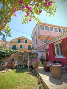 a house with a patio in front of it at PENELOPE'S STREET OLD HOUSE in Lefkada