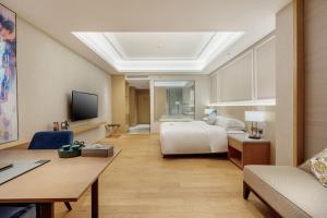 Huangshan Parkview International Hotel的电视和/或娱乐中心