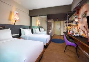 Postel nebo postele na pokoji v ubytování Viva Dash Hotel Seminyak