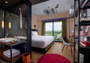 Postel nebo postele na pokoji v ubytování Viva Dash Hotel Seminyak