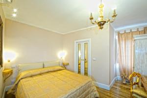 Postel nebo postele na pokoji v ubytování Boutique Hotel L'Imperatrice