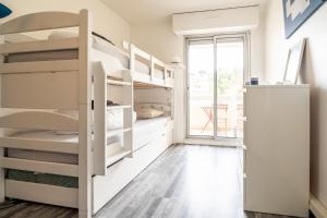 a dorm room with bunk beds and a window at Le Syrius in Nice +28 photos