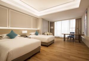 Huangshan Parkview International Hotel客房内的一张或多张床位