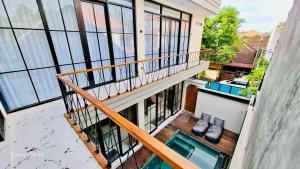 an overhead view of a balcony of a building at Vila Cartenz in Jimbaran