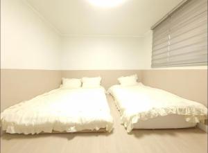 Postel nebo postele na pokoji v ubytování Elimhouse