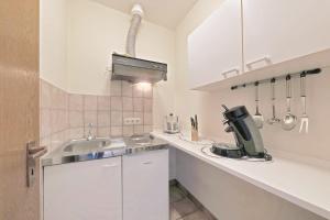 Kuchyň nebo kuchyňský kout v ubytování Hotel Hülsmann Garni
