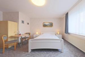 Postel nebo postele na pokoji v ubytování Hotel Hülsmann Garni