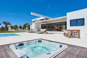 a villa with a hot tub in the backyard of a house at Villa Can Pep de Sa Guaita Amaizing Design & Outdoor Area 10 minutes from beaches Calm Area in Ibiza Town