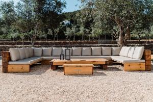 a couch and a coffee table in a park at Villa Can Pep de Sa Guaita Amaizing Design & Outdoor Area 10 minutes from beaches Calm Area in Ibiza Town