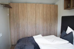 Ein Bett oder Betten in einem Zimmer der Unterkunft Franz Josefs Tinyhäuser