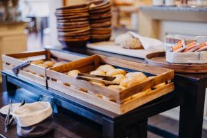 a tray of pastries on a table in a kitchen at NP Hotel Ullrich in Elfershausen +42 photos