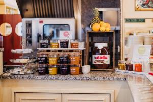 a counter with a bunch of different types of drinks at NP Hotel Ullrich in Elfershausen