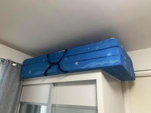 a blue container is sitting on top of a window at Aesthetic 2 Bedroom The Loop Tower Condo Unit in Cagayan de Oro