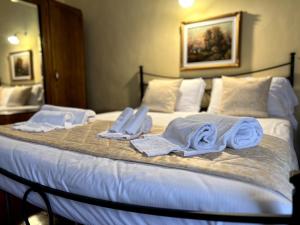 Postel nebo postele na pokoji v ubytování Sangemini Home