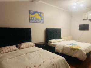 Ένα ή περισσότερα κρεβάτια σε δωμάτιο στο HomeAway Self Catering Accommodation