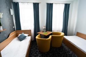Łóżko lub łóżka w pokoju w obiekcie Hotel SANVIT RESTAURACJA & SPA