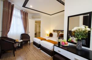 Ένα ή περισσότερα κρεβάτια σε δωμάτιο στο Serenity Diamond Hotel
