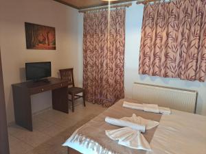 A television and/or entertainment centre at Anilio Rooms