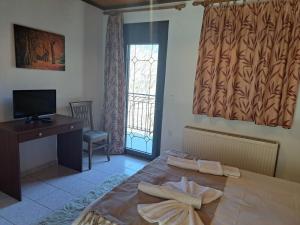 A television and/or entertainment centre at Anilio Rooms