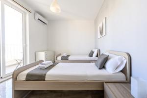 Postel nebo postele na pokoji v ubytování F9 Room 3, Private Room two single beds with shared bathroom in shared Flat