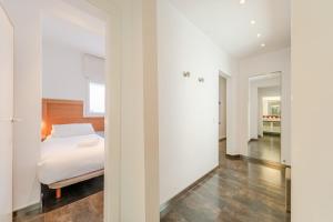 A bed or beds in a room at Stay U-nique Apartments Eslava