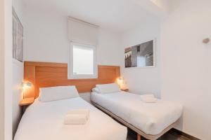 A bed or beds in a room at Stay U-nique Apartments Eslava