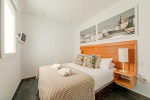 A bed or beds in a room at Stay U-nique Apartments Eslava