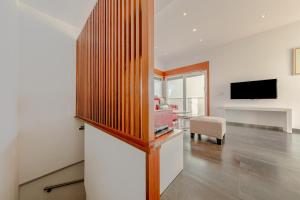 A television and/or entertainment centre at Stay U-nique Apartments Eslava