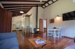 a living room with a couch and a table at Stargazers Forest Hideaway Pemberton in Peerabeelup